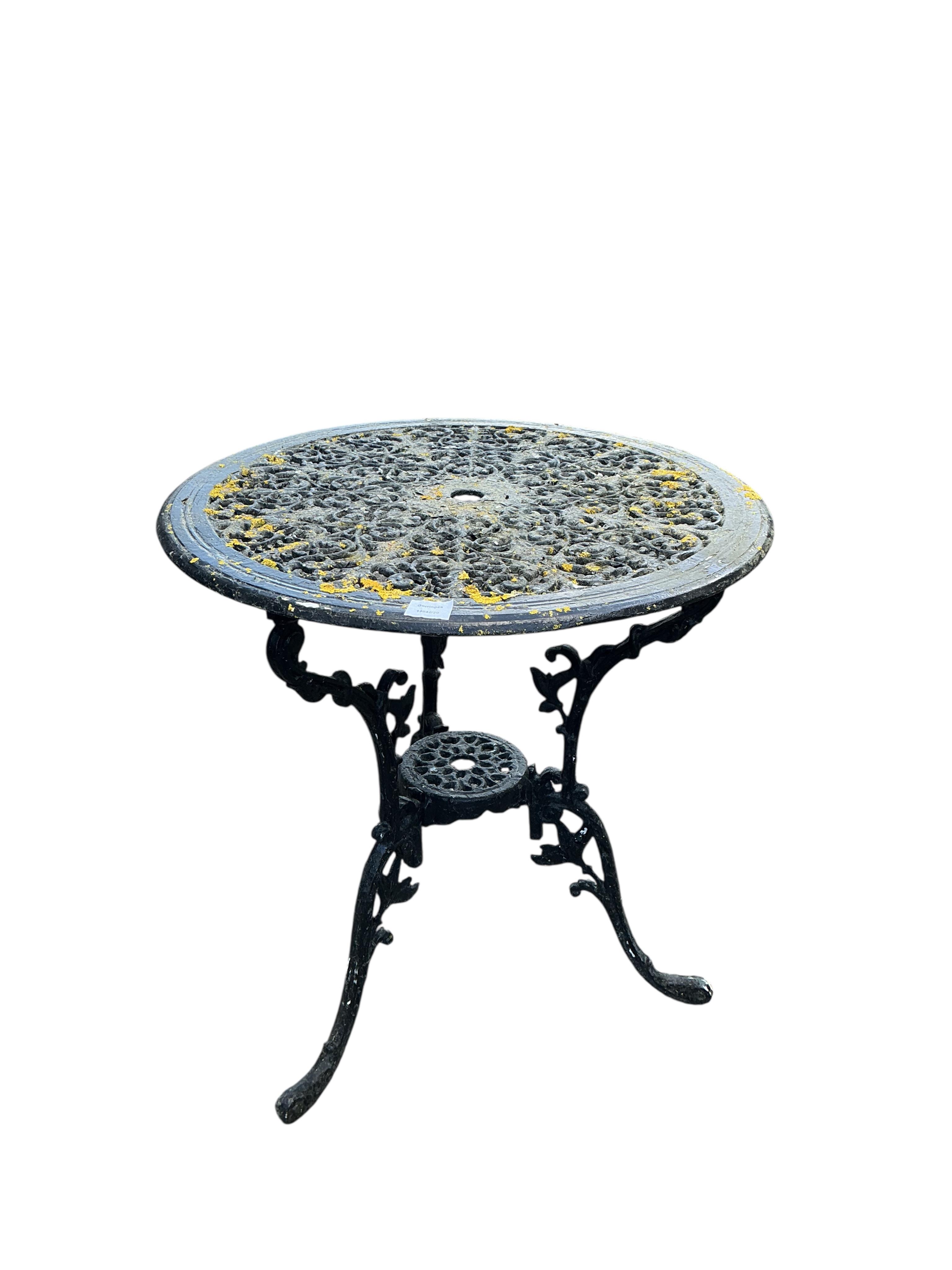 A Victorian style painted aluminium garden table, diameter 66cm and three chairs